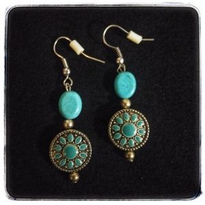 Gorgeous turquoise colored Sun style earrings